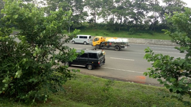 Kondisi jalan tol Jagorawi. (Foto: Ainul Qalbi/kumparan)