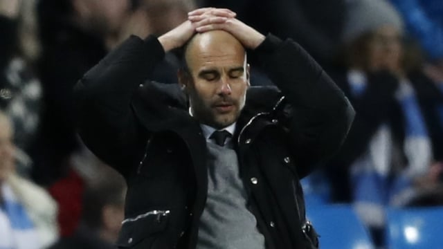 Pep Guardiola menyesali timnya gagal menang (Foto:  Carl Recine/Reuters)