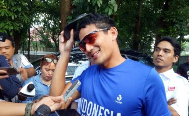Sandi lari pagi sebelum mencoblos. (Foto: Ochi Amanaturrosyidah/kumparan)