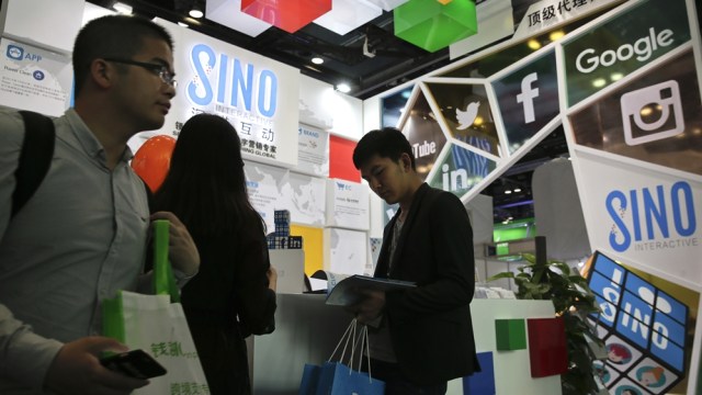 Perusahaan media digital di China (Foto: AP Photo/Andy Wong)
