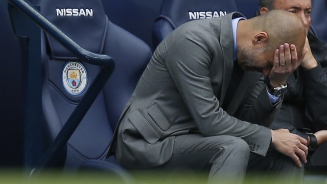 Pusing kepala Pep. (Foto: Reuters/Andrew Yates)