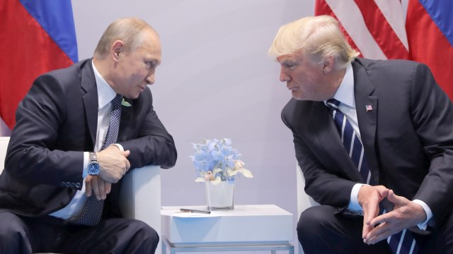 Pertemuan Trump dan Putin. Foto: REUTERS/Carlos Barria