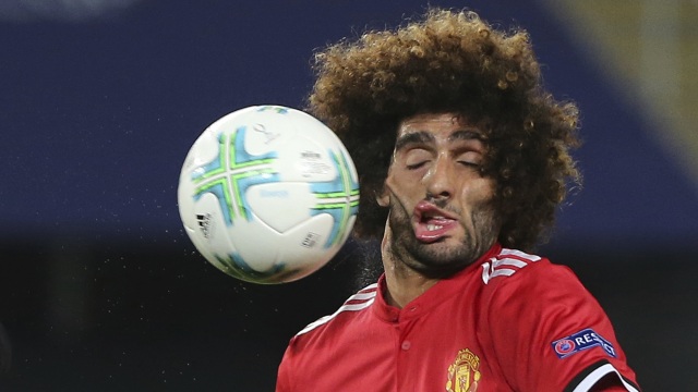 Ekspresi Marouane Fellaini (Foto: Boris Grdanoski/AP Photo)