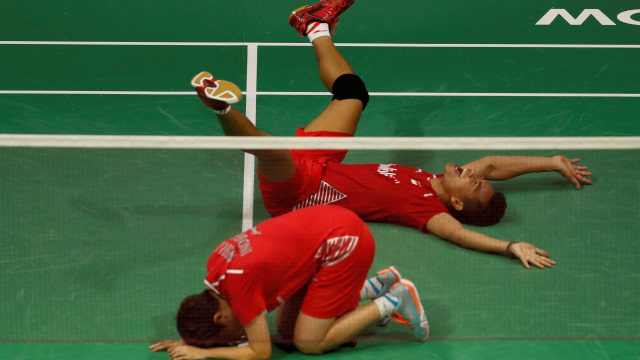 Owi/Butet usai memastikan gelar juara dunia. (Foto: REUTERS/Russell Cheyne)