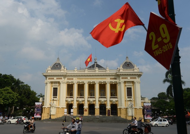 Ilustrasi Sosialis di Vietnam (Foto: HOANG DINH NAM / AFP)