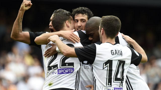 Perayaan kemenangan oleh para penggawa Valencia.  (Foto: JOSE JORDAN / AFP)