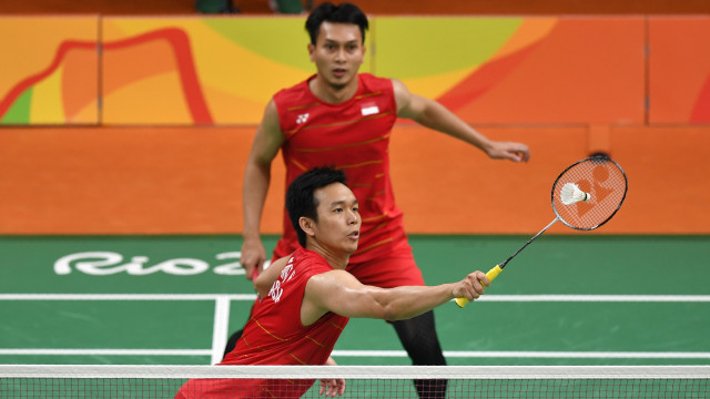 Aksi Hendra/Ahsan. (Foto: Ed JONES / AFP)
