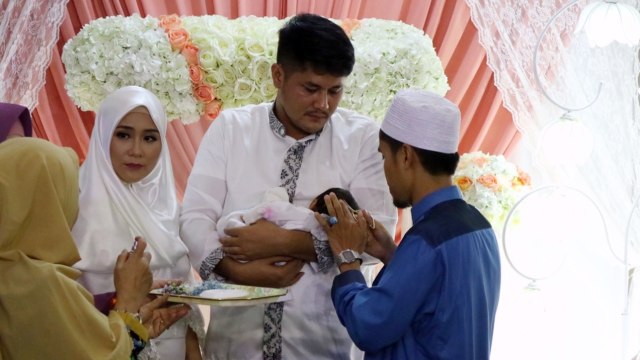 Aqiqah Ryana Dea dan Puadin Redi (Foto: Sarah Yulianti Purnama/kumparan)