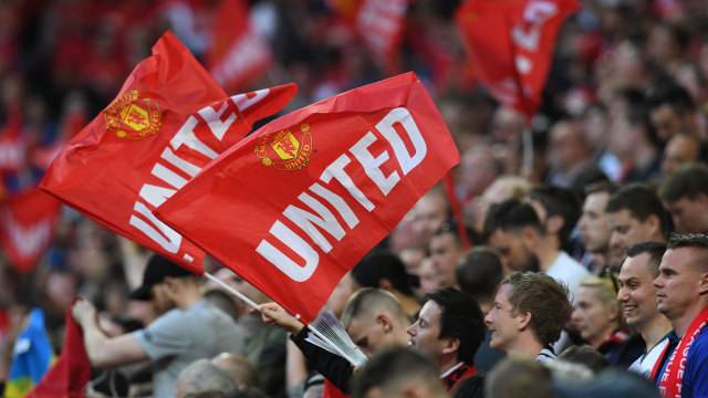 Suporter Manchester United. (Foto: Paul ELLIS / AFP)