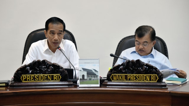 Joko widodo dan Jusuf kalla (Foto: AFP PHOTO / Bay ISMOYO)
