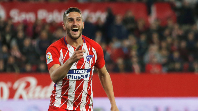 Perayaan gol Koke ke gawang Sevilla.  (Foto: REUTERS/Jon Nazca)