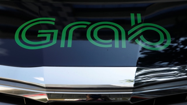 Layanan mobil panggilan GrabCar dari Grab. Foto: REUTERS/Edgar Su
