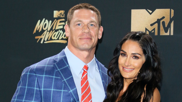 John Cena dan Nikki Bella. (Foto: AFP/Jean-Baptiste Lacroix)