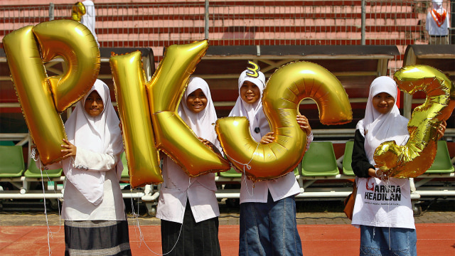Sejumlah pendukung dari Partai Keadilan Sejahtera. (Foto: AFP PHOTO / Juni Kriswanto)