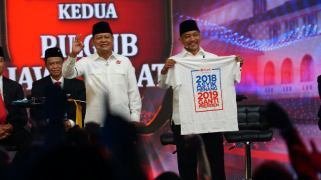 Kaos 2018 asyik Menang 2019 Ganti Presiden. (Foto: Iqbal/kumparan)