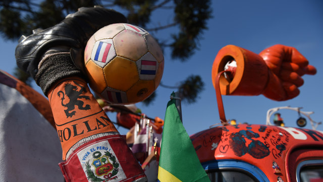 Ilustrasi dukungan Timnas Belanda. (Foto: EITAN ABRAMOVICH / AFP)