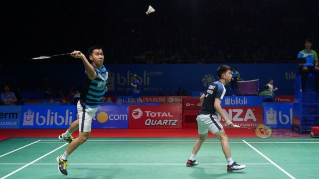 Pebulu tangkis Indonesia, Marcus Fernaldi Gideon dan Kevin Sanjaya Sukamuljo, pada Turnamen Bulu Tangkis Blibli Indonesian Open 2018 di Istora Senayan, Jakarta, kamis (5/7). (Foto: Irfan Adi Saputra/kumparan)