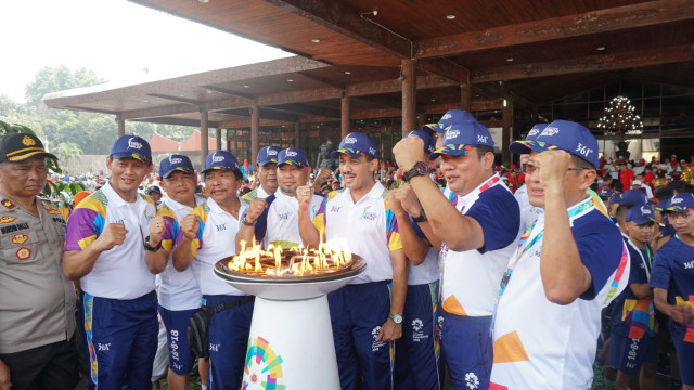 Torch Relay Obor Asian Games 2018 di TMII, Jakarta, Rabu (15/8/2018). (Foto: Nugroho Sejati/kumparan)