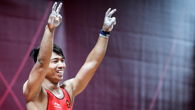 Deni, atlet angkat beban 69 kg Indonesia. (Foto: ANTARA FOTO/INASGOC/Dhemas Reviyanto)