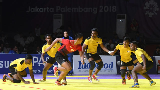 I Nyoman Tos Pasek Wiguna di laga vs Malaysia. (Foto:  INASGOC/Syaiful Arif)