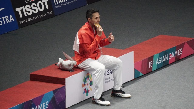 Jonatan Christie mendapat emas di cabang olah raga bulu tangkis Asian Games 2018, Selasa (28/8/2018). (Foto: Aditia Noviansyah/kumparan)