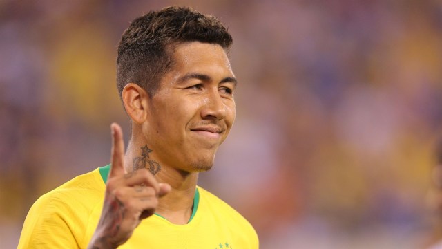 Roberto Firmino tersenyum usai membobol gawang Amerika Serikat. (Foto: USA Today/Reuters/Brad Penner)