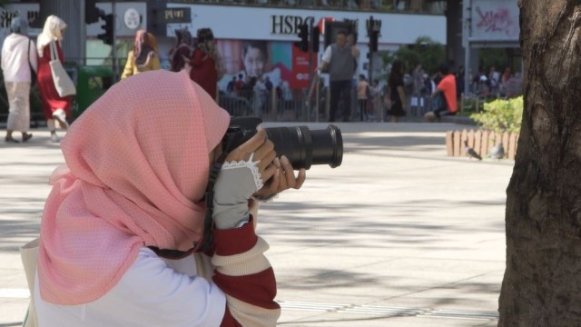 Peserta lomba foto street kumparan BNI Photofun hunting foto Di Victoria Park Hong Kong, Minggu (21/10). (Foto: Dok. kumparan)