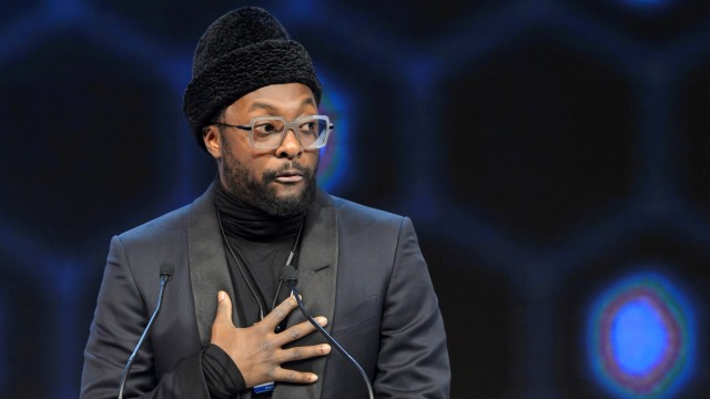 Will.i.am anggota Black Eyed Peas. (Foto: AFP/FABRICE COFFRINI)