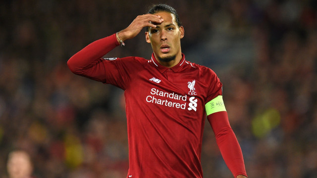 Virgil van Dijk menjadi kapten Liverpool. (Foto: Oli Scarf/AFP)