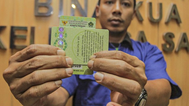 Ilustrasi kartu nikah. Foto: ANTARA FOTO/Muhammad Adimaja