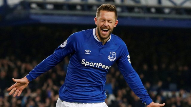 Sigurdsson melakukan selebrasi untuk gol kemenangannya ke gawang Cardiff City. (Foto: Reuters/Ed Sykes)