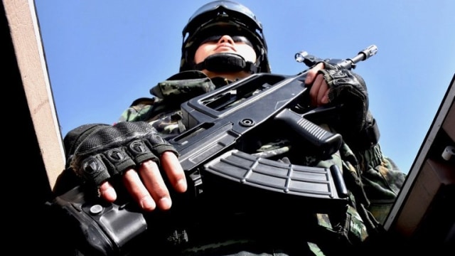 Polisi China di Xinjiang, China (Foto: AFP/STR)