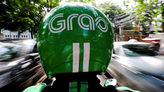 Ojek motor Grab. Foto: REUTERS/Beawiharta