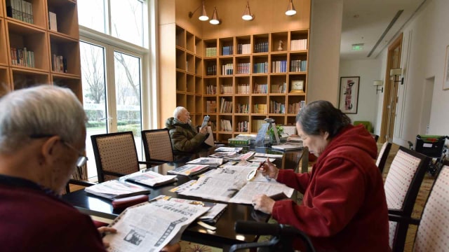 Ilustrasi perpustakaan China. Foto: AFP/GREG BAKER