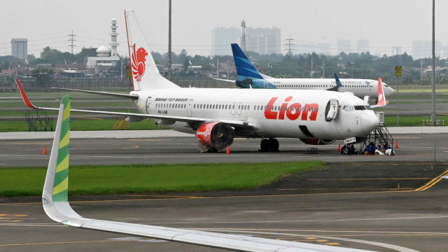 Lion Air dan Garuda Indonesia di Bandara Internasional Soekarno-hatta, Jakarta. Foto: AFP/Adek BERRY