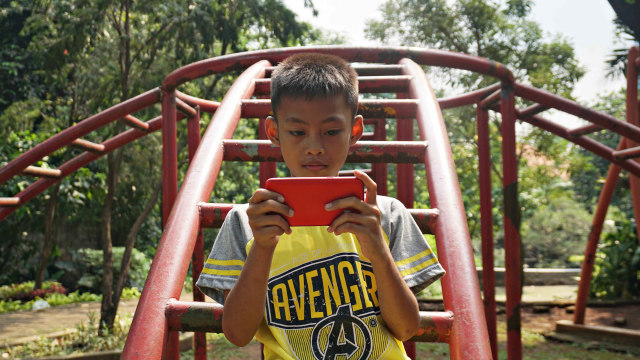 Ilustrasi anak main video game. Foto: Abil Achmad Akbar/kumparan