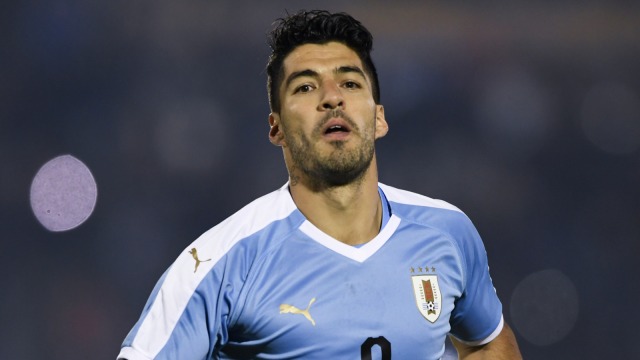 Suarez bersama Timnas Uruguay. Foto: AFP/Pablo Porciuncula Brune