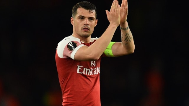 Granit Xhaka saat menjadi kapten Arsenal. Foto: Glyn KIRK / AFP