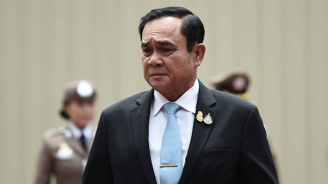 Perdana Menteri Thailand Prayuth Chan-O-Cha saat hadir di upacara di markas besar kepolisian di Bangkok (2/8). Foto: AFP/Lillian SUWANRUMPHA