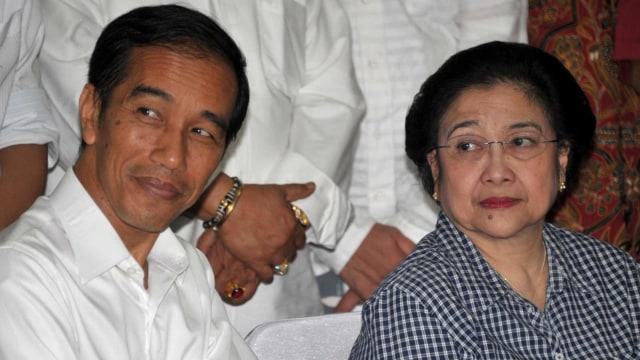 Joko Widodo dan Megawati Soekarnoputri. Foto: AFP/BAY ISMOYO