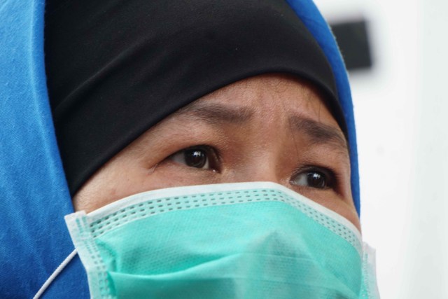 Tersangka Aulia Kesuma saat melakukan rekonstruksi pembunuhan Pupung dan Dana di kawasan Apartemen Kalibata City, Jakarta. Foto: Irfan Adi Saputra/kumparan