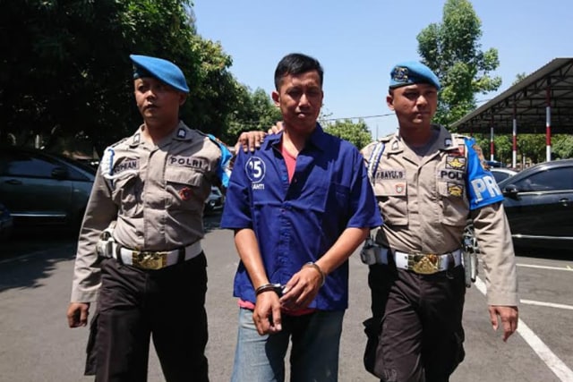 Tersangka Sigit Seno Susanto yang di gelandang ke Mapolresta Solo, (Agung Santoso)