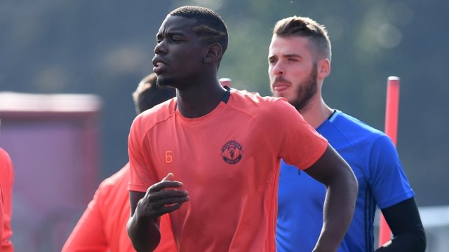 Dua penggawa andalan Manchester United, Paul Pogba dan David de Gea.  Foto: PAUL ELLIS / AFP