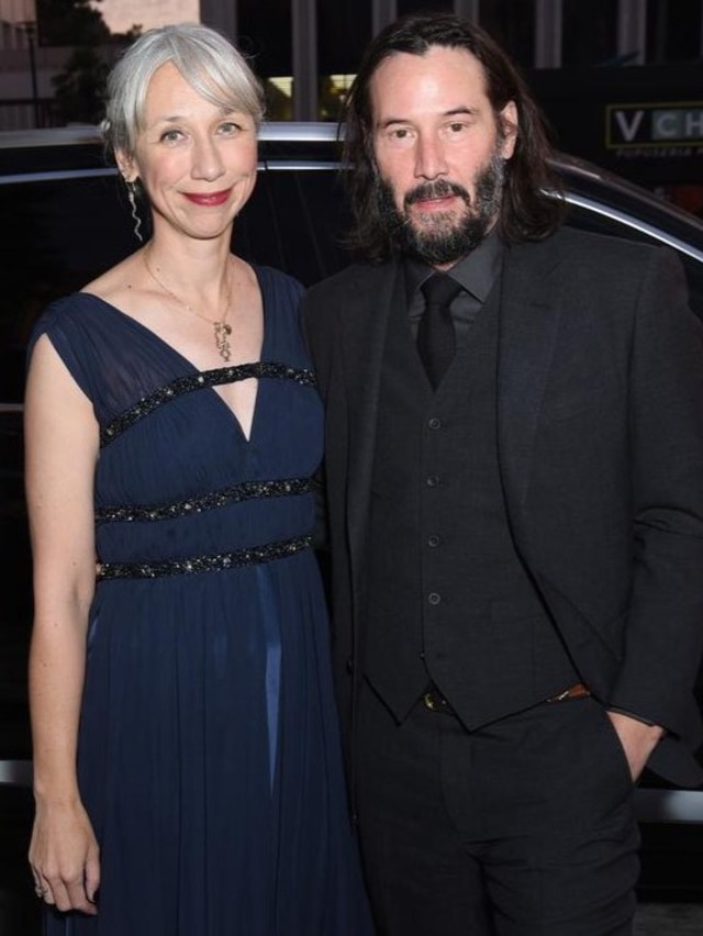 Keanu Reeves dan Alexandra Grant.
 Foto: Presley Ann/Getty Images/AFP