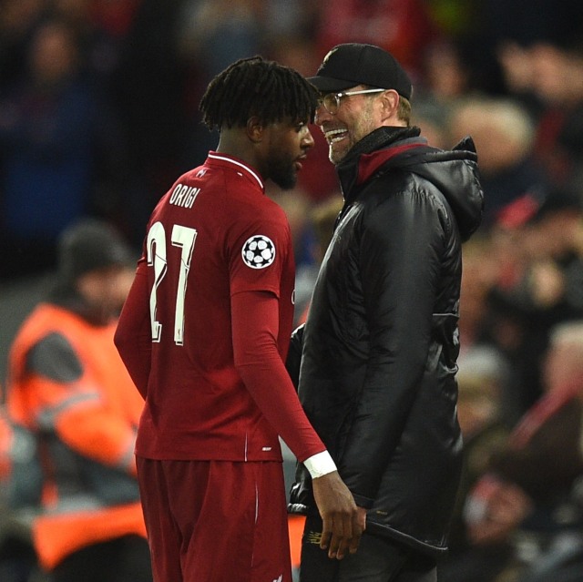 Divock Origi dan Juergen Klopp. Foto: Oli SCARFF / AFP