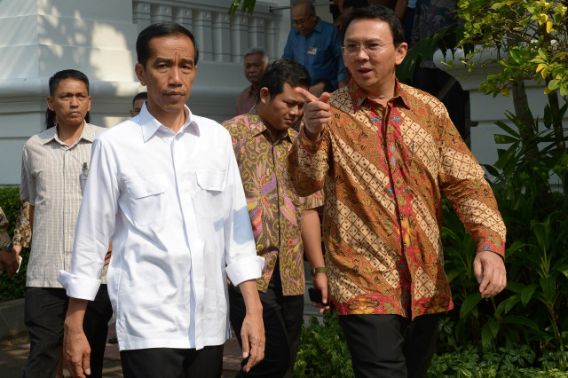 Presiden Joko Widodo bersama Mantan Gubernur DKI Jakarta Basuki Tjahaja Purnama pada 22 Oktober 2014. Foto: AFP/ADEK BERRY