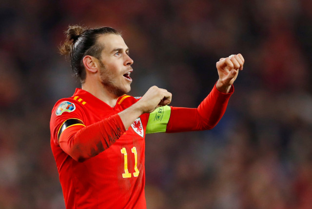 Gareth Bale merayakan kelolosan Wales ke putaran final Piala Eropa 2020. Foto: ANDREW BOYERS/Reuters.
