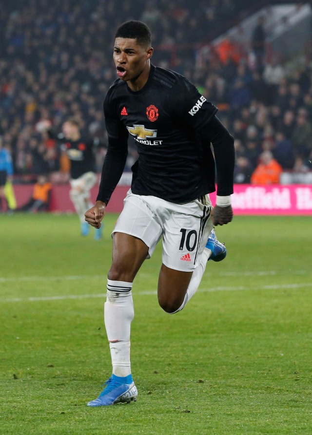 Penyerang muda Manchester United, Marcus Rashford, merayakan golnya ke gawang Sheffield United.  Foto: REUTERS/Andrew Yates
