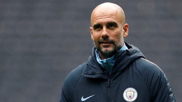 Guardiola dirumorkan akan melatih Juventus pada musim depan. Foto: Reuters/John Sibley