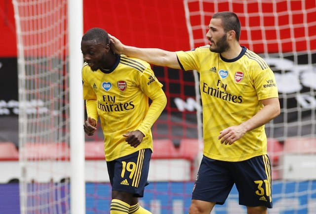 Nicolas Pepe dan Sead Kolasinac, pemain Arsenal, dalam laga versus Sheffield United di Piala FA 2019/20. Foto: REUTERS / Andrew Boyers / Pool